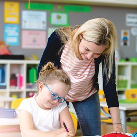 Female teacher with female student