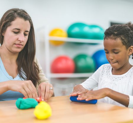 Female teacher with female student